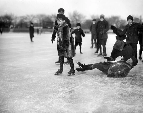 ICE SKATERS, c1920. Joseph and Thomas Leiter and others ice skating on a lake
