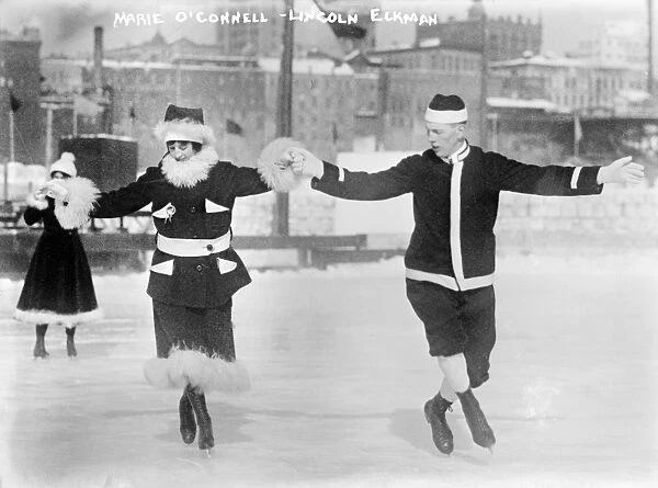 ICE SKATERS. Marie O Connell and Lincoln Elkman ice skating together, wearing Santa Claus suits