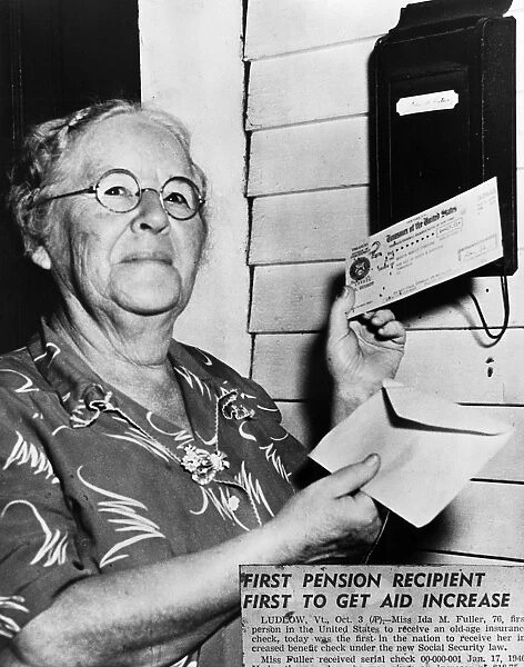 Ida May Fuller (1874-1975) of Ludlow, Vermont, the first beneficiary under the Social Security system, holding her first check, January 1940