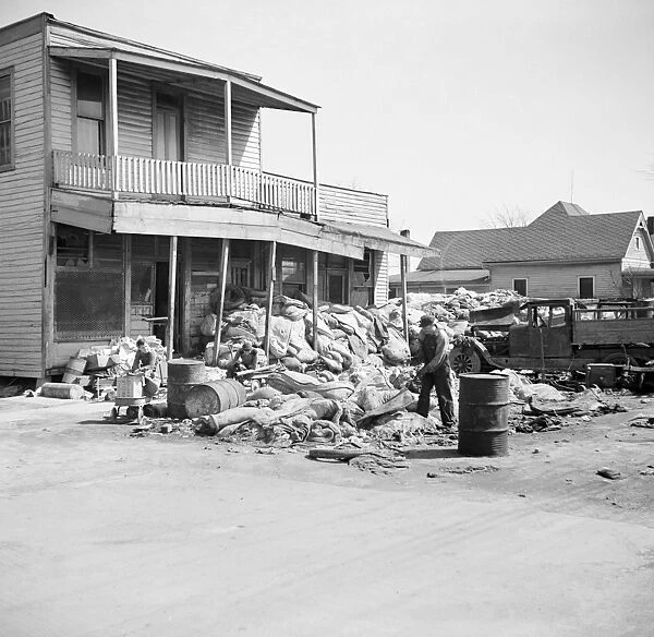 ILLINOIS: FLOOD, 1937. Debris from a damaged house after a flood in Harrisburg, Illinois