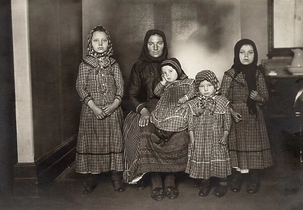 IMMIGRANT FAMILY, c1900. An immigrant woman and her four children. Photograph by Lewis W