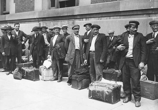 IMMIGRANTS: ELLIS ISLAND. A group of Italian immigrant men preparing to leave Ellis Island