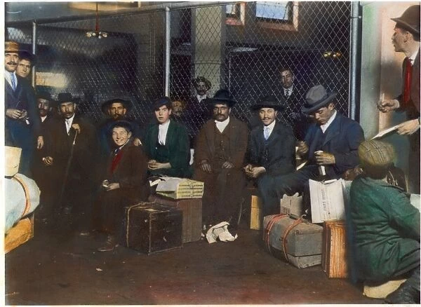 IMMIGRANTS: ELLIS ISLAND. A group of Italian men and boys at Ellis Island: photographed