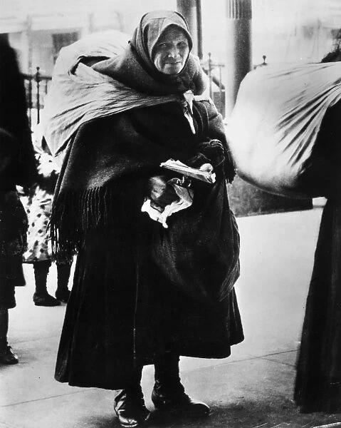 IMMIGRANTS: ELLIS ISLAND. An immigrant woman at Ellis Island, c1900