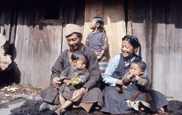 INDIA: FAMILY, 1971. The Jorbu family seated outside their home in Lachung, Sikkim, India