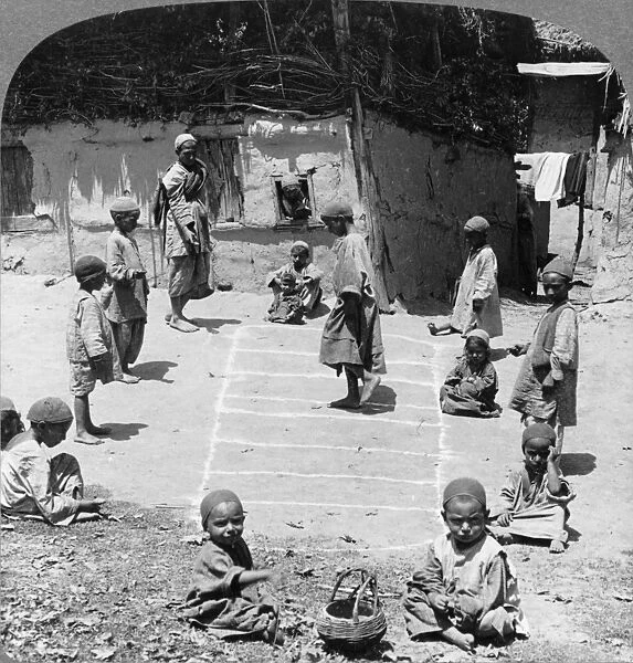 INDIA: HOPSCOTCH, c1903. Children playing hopscotch in Cashmere, India. Stereograph