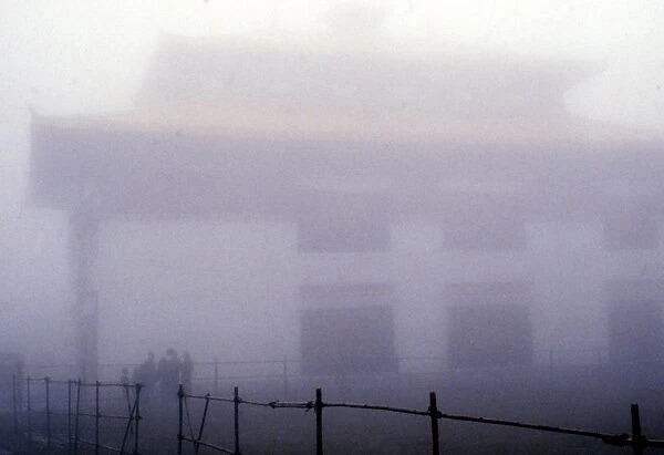 INDIA: SIKKIM, 1979. People standing in the mist in Sikkim, India. Photograph by Alice S
