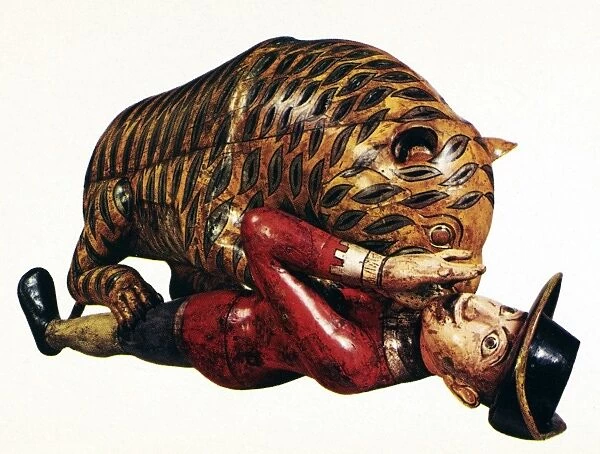 INDIA: TIGER ATTACK. Wooden sculpture of a tiger attacking an employee of the East India Company, Indian, 18th century
