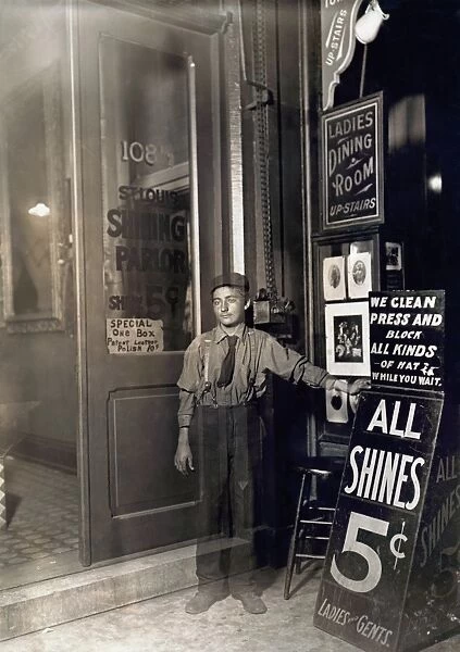 INDIANA: BOOTBLACK, 1908. A young Greek-American bootblack with a sign in Indianapolis, Indiana