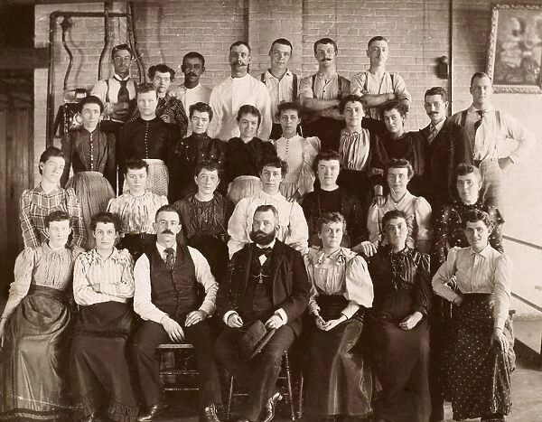 INDUSTRY PORTRAIT, c1900. Group portrait of workers and managers at an unidentified