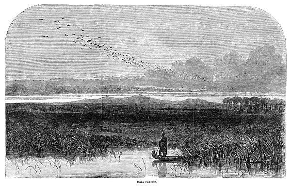 IOWA: PRAIRIE, 1858. A Native American in a canoe in Iowa. Wood engraving, English