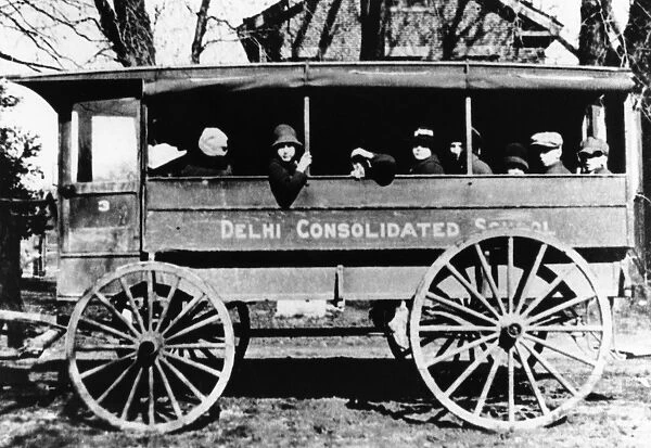 IOWA: SCHOOL BUS, c1920. A local school bus in Delhi, Iowa. Photograph, c1920
