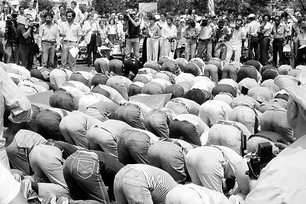 IRANIAN HOSTAGE CRISIS, 1980. Iranian men bowing in prayer at a demonstration in Washington, D