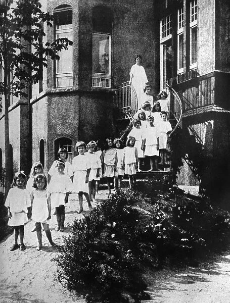 ISADORA DUNCAN (1877-1927). American dancer. Duncan (top) with her students at Grunewald