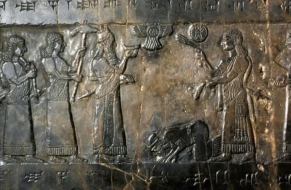 ISRAELITE SUBMISSION. Submission of the Israelites to Shalmaneser III of Assyria. Assyrian bas-relief from Nimrud, c825 B. C
