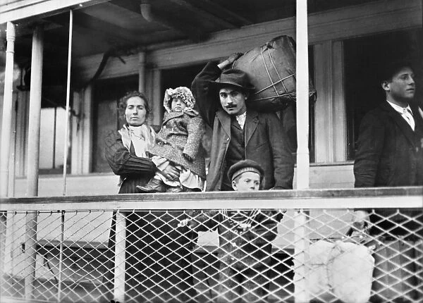 ITALIAN IMMIGRANT FAMILY. A family of Italian immigrants on board the Ellis Island