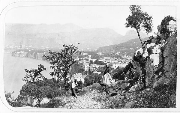 ITALY: SORRENTO, c1869. A couple on a high cliff above the town of Sorrento, Italy