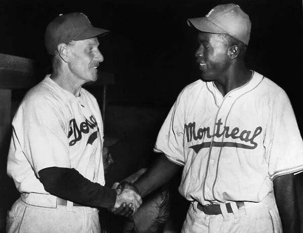JACKIE ROBINSON (1919-1972). John Roosevelt Robinson, known as Jackie. American baseball player. As a member of the Montreal Royals, the top minor-league affiliate of the Brooklyn Dodgers, shaking hands with Dodger manager Leo Durocher (left) at a spring training exhibition game in Havana, Cuba, March 1947, one month before making his major league debut