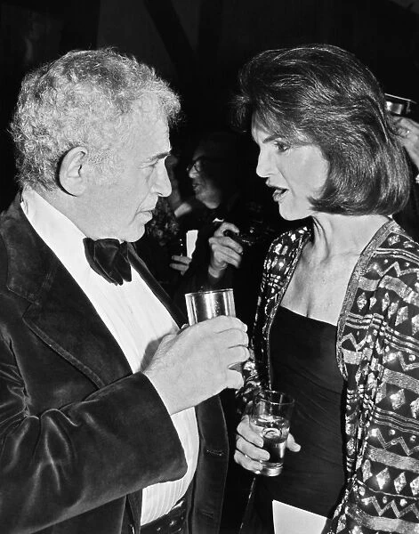 JACQUELINE KENNEDY ONASSIS (1929-1994). Wife of Aristotle Onassis and President John Fitzgerald Kennedy. Onassis with Norman Mailer at a publishing party in New York. Photographed 1978