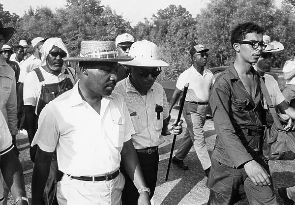 James Meredith (with cane) and Martin Luther King, Jr. during the Freedom March from Canton, Mississippi to the Tougaloo College campus, 25 June 1966