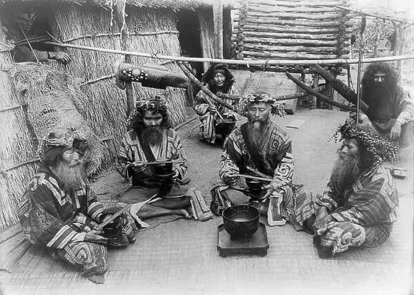 JAPAN: AINU, c1905. A group of Ainu men and women in ceremonial dress in Japan