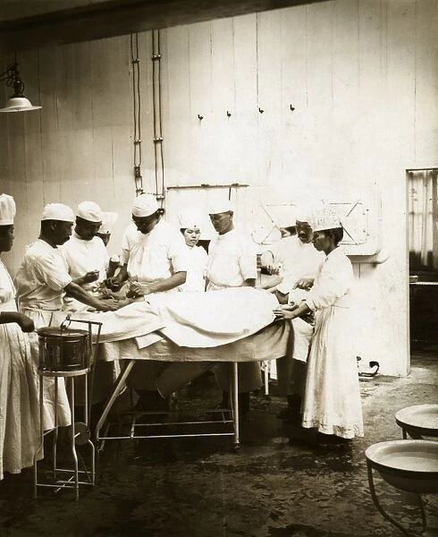 JAPAN: HOSPITAL, c1905. Doctors performing surgery in an operating room at a hospital in Japan
