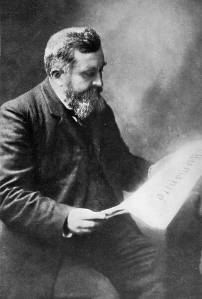 JEAN LEON JAURES (1859-1914). French socialist and politician. Reading a copy of L Humanite