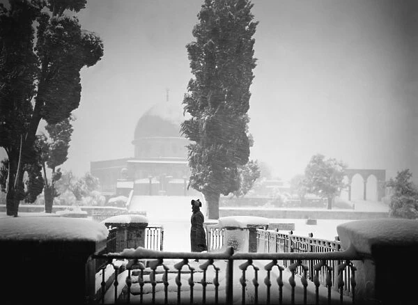JERUSALEM: BLIZZARD. A man walking before the Dome of the Rock, during a blizzard in Jerusalem