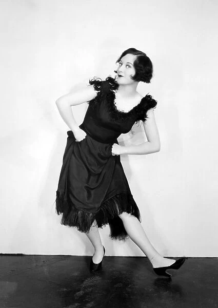 JOAN CRAWFORD (1908-1973). American actress. Crawford doing the Black Bottom dance in a publicity still from the 1920s