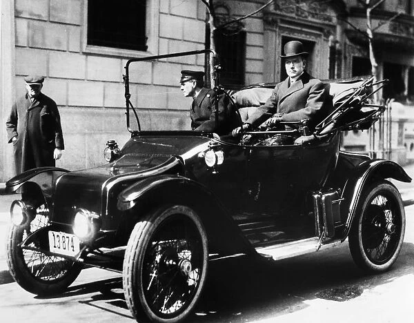 JOHN D. ROCKEFELLER (1839-1937). American oil magnate. Photographed in his electric car