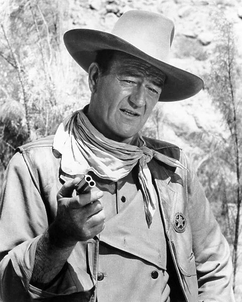 JOHN WAYNE (1907-1979). American actor. Wayne in a scene from The Comancheros