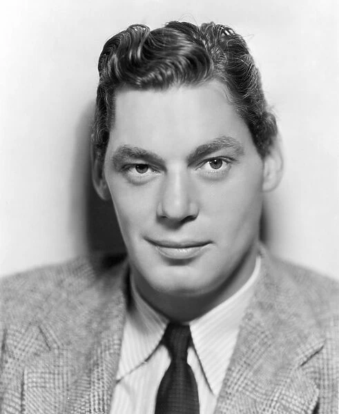JOHNNY WEISSMULLER (1904-1984). American swimmer and cinema actor. Photographed c1936