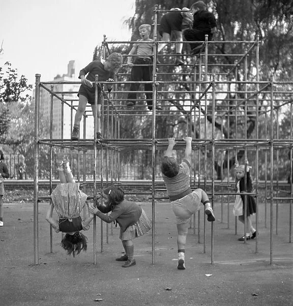JUNGLE GYM, 1942. Children climbing on a jungle gym in the Central Park playground, New York City