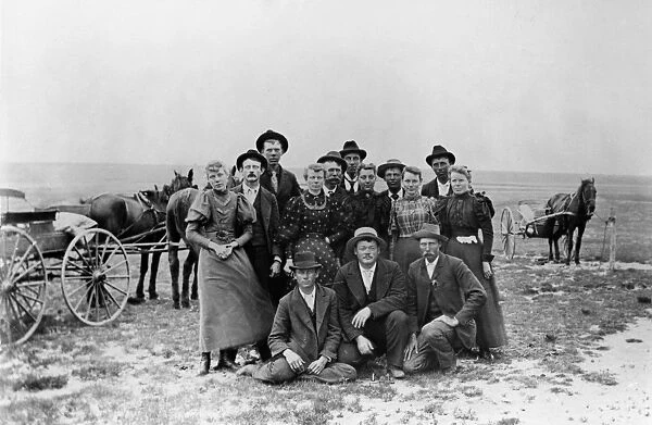 KANSAS: PIONEERS. A group of emigrants posing for the photographer on the Kansas prairie