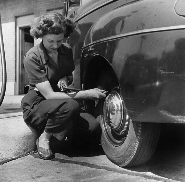 KENTUCKY: GAS STATION, 1942. Virginia Lively, a wartime gas station attendant in Louisville