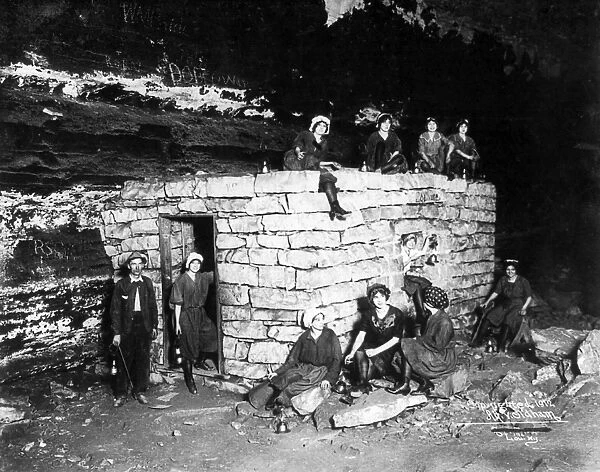 KENTUCKY: MAMMOTH CAVE. Ten young women and one man posing by a small room used