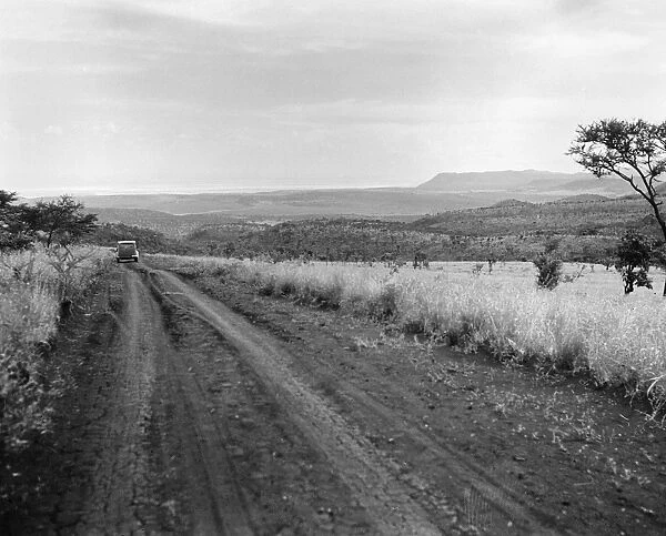 KENYA: HIGHWAY, 1936. Scene along a muddy highway in the Rift Valley in Kenya