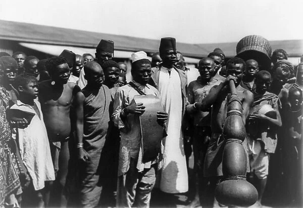 KENYA: MUSICIANS, c1907. Public gathering around men with musical instruments in Mombasa, Kenya