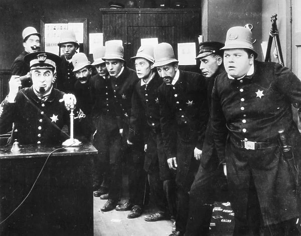 KEYSTONE KOPS. A scene from In the Clutches of a Gang, c1913. Fatty Arbuckle is at the extreme right