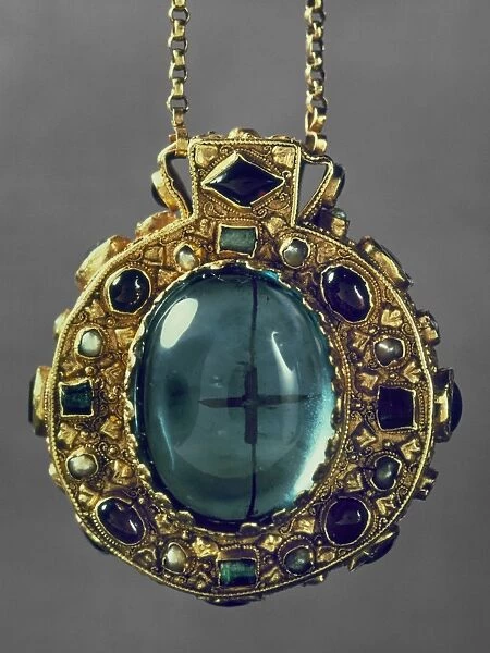 King of the Franks, 768-814, and Emperor of the West, 800-814. Gold talisman of Charlemagne, late 8th-9th century, a reliquary in the shape of an ampulla purported to contain fragments of the True Cross, which can be seen through the large gems on the back and front