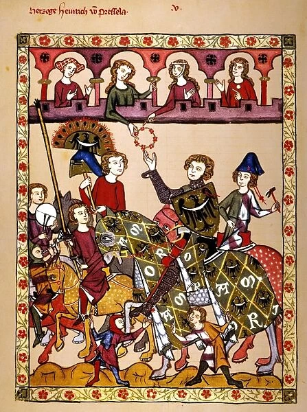 KNIGHT, 14th CENTURY. The minnesinger Herzog Heinrich von Breslau receiving the victors wreath at the end of a tournament. Illumination from the early 14th century great Heidelberg Lieder manuscript