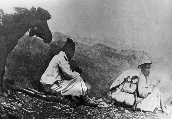 KOREA: TRAVELERS, c1900. Two travelers and their donkey resting in the mountains, c1900