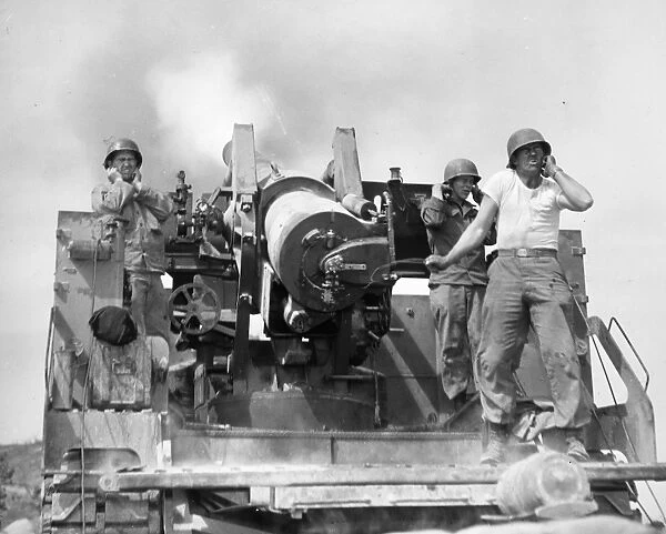 KOREAN WAR: ARTILLERYMEN. U. S. artillerymen firing an eight-inch self-propelled gun against a Communist-held position at the Korean front, 1952