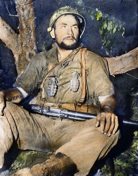 KOREAN WAR: G. I. 1950. A G. I. resting after serving 43 straight days on the front lines in Korea, September 1950. Oil over a photograph