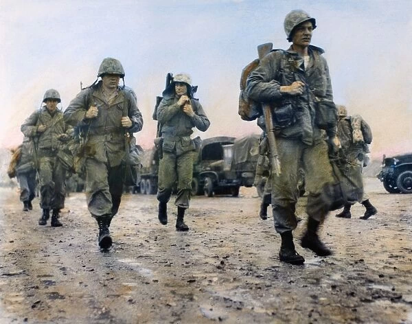 KOREAN WAR: MARINES, 1953. U. S. Marines in Korea heading for helicopters to take them to the front, March 1953. Oil over a photograph