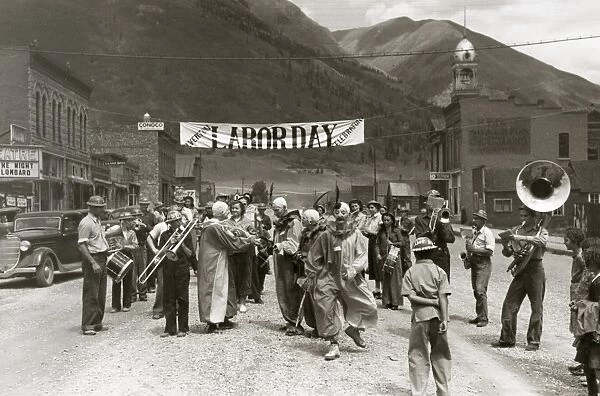 LABOR DAY PARADE, 1940. Band and clowns at a Labor Day celebration in Silverton, Colorado