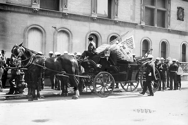 LABOR DAY PARADE, c1908. Horse-drawn buggy carrying picket signs in preparation