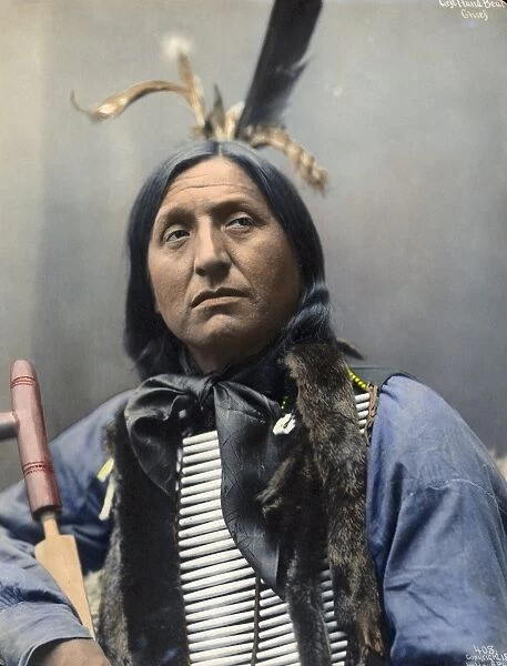 LEFT HAND BEAR, c1899. Oglala Sioux chief. Hand colored platinum print photograph