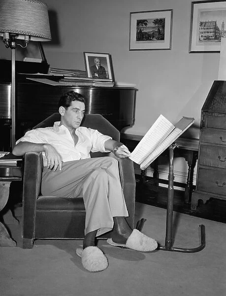 LEONARD BERNSTEIN (1918-1990). American composer and conductor. At his home in New York City
