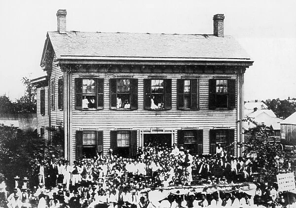 LINCOLN CAMPAIGN, 1860. Republican Party rally during the summer of 1860 at Abraham Lincolns home in Springfield, Illinois. Lincoln stands on his doorstep in a white suit